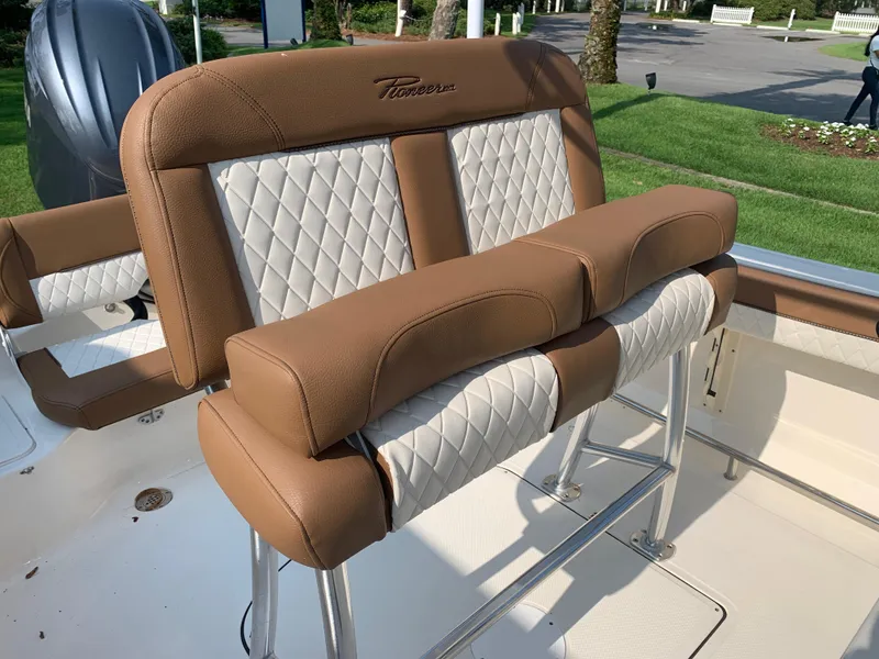 Slide: The Image of 2025 Pioneer 202 Islander boat seating with brown and white upholstery, showcasing luxury design. - 7