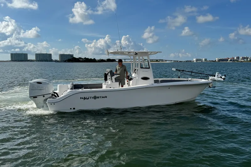 Slide: The Image of 2025 NauticStar 252 Legacy boat cruising on a sunny day. - 14