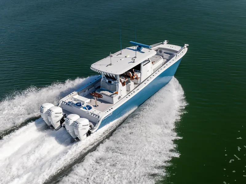 Slide: The Image of Freeman 43 boat cruising on water, 2022 model, with dual outboard engines. - 13