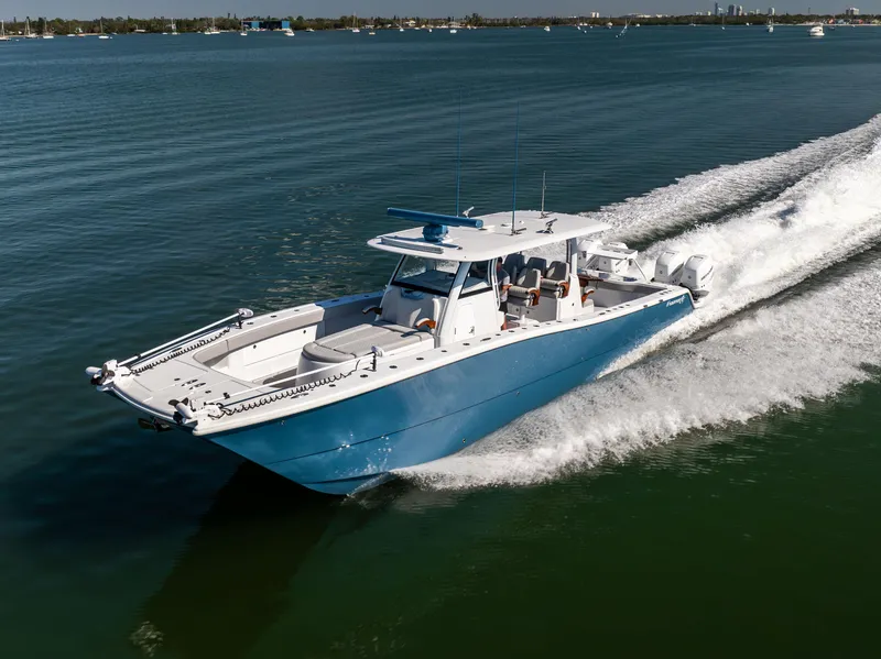 Slide: The Image of 2022 Freeman 43 boat cruising on open water, showcasing sleek design and powerful performance. - 17