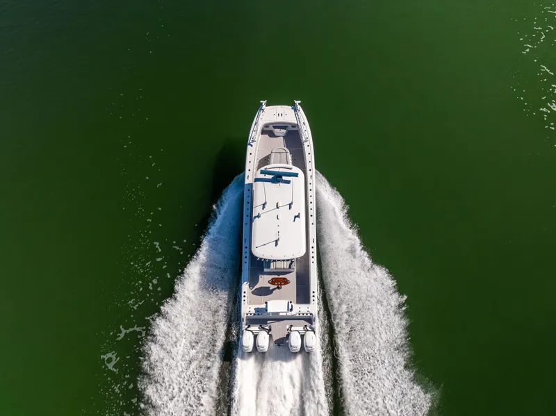 Slide: The Image of Aerial view of 2022 Freeman 43 boat cruising on green water. - 19