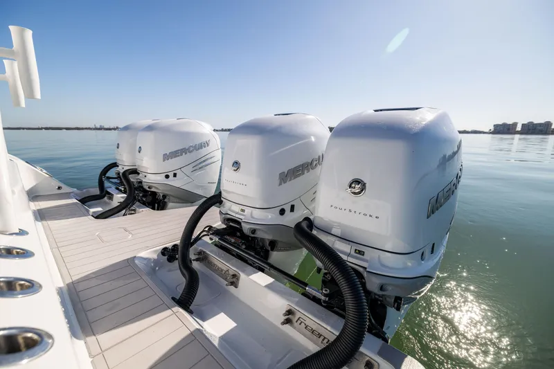 Slide: The Image of Freeman 43 boat with triple Mercury outboard engines, 2022 model, on calm water. - 26