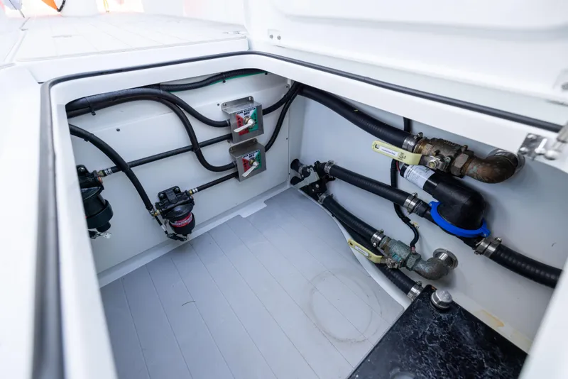 Slide: The Image of Freeman 43 boat engine compartment, 2022 model, showcasing wiring and plumbing details. - 29