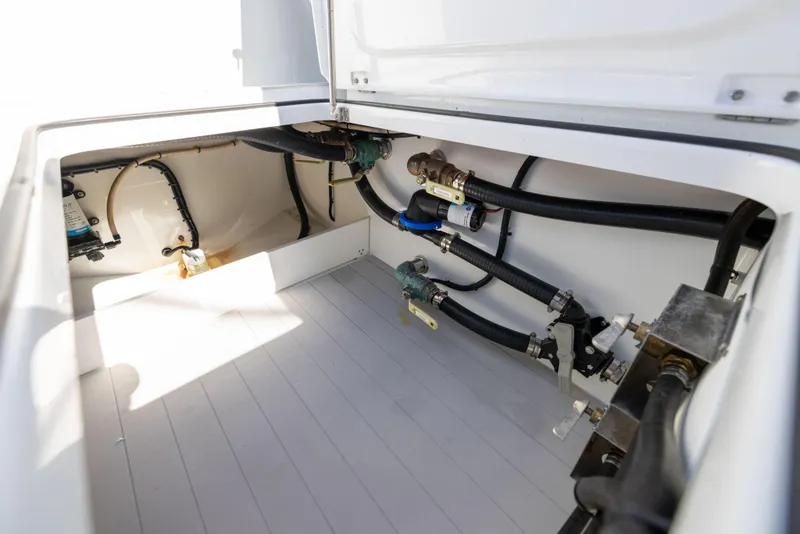 Slide: The Image of Freeman 43 boat interior showing plumbing and storage area, 2022 model. - 30