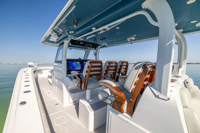 Slide: The Image of 2022 Freeman 43 boat interior with sleek seating and modern navigation equipment. - 33