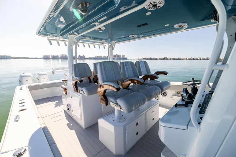 Slide: The Image of 2022 Freeman 43 boat interior with luxurious seating and modern design on calm water. - 35