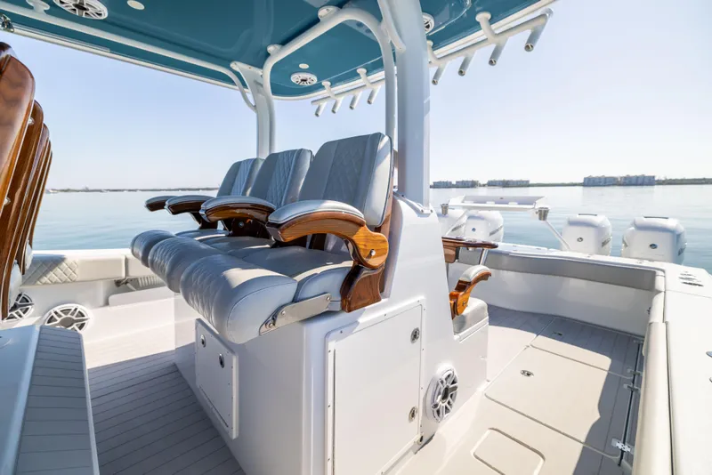 Slide: The Image of Luxurious seating on a 2022 Freeman 43 boat, featuring sleek design and ocean backdrop. - 36