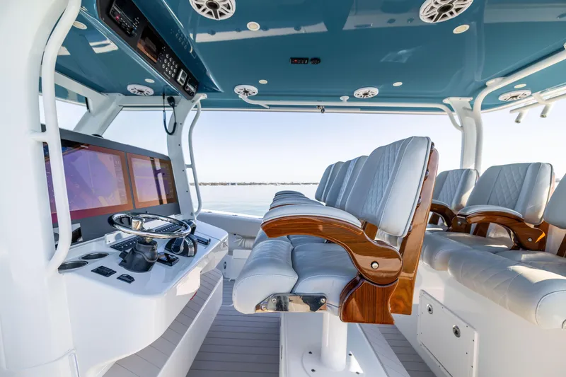 Slide: The Image of 2022 Freeman 43 boat interior with luxurious seating and advanced navigation controls. - 37