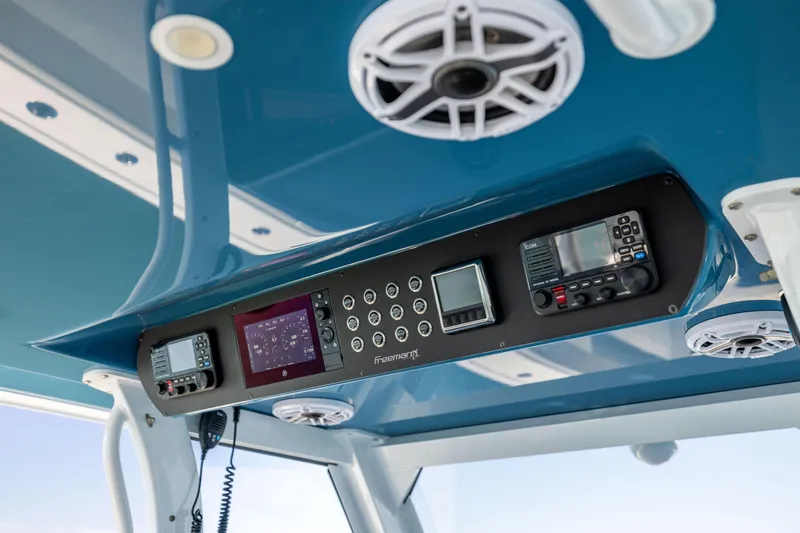 Slide: The Image of Control panel of a 2022 Freeman 43 boat with navigation and communication equipment. - 43