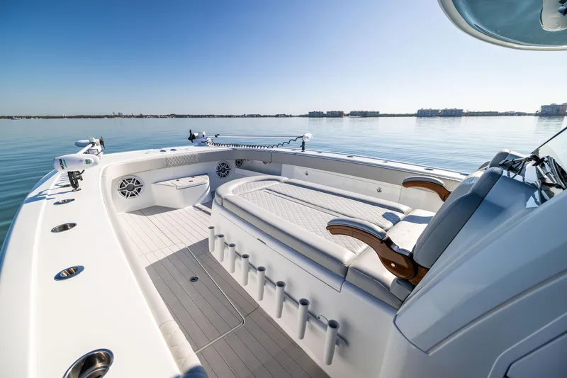 Slide: The Image of 2022 Freeman 43 boat interior with seating, on calm water. - 46