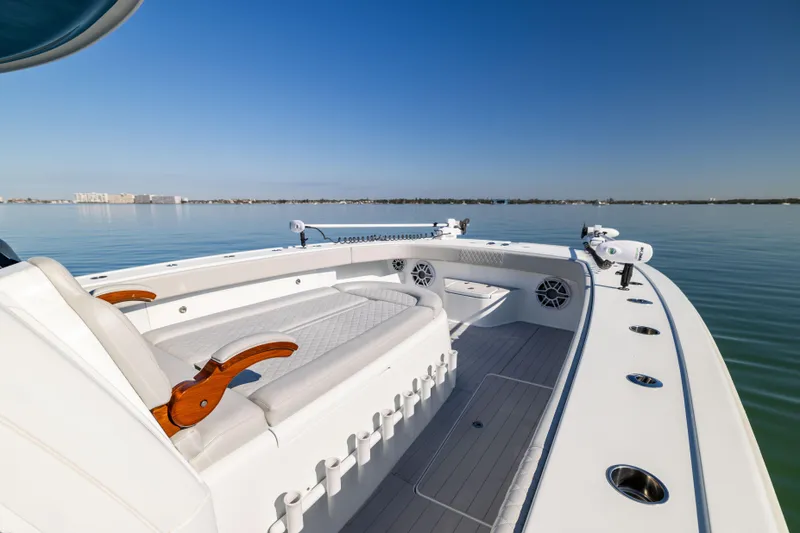Slide: The Image of 2022 Freeman 43 boat interior with sleek white seating and ocean view. - 47