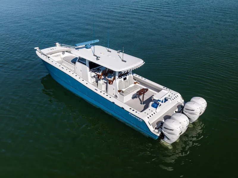 Slide: The Image of Freeman 43 boat, 2022 model, cruising on calm water with twin engines. - 7