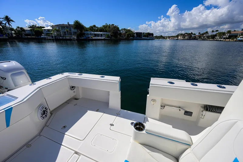 Slide: The Image of 2008 SeaVee 39b boat deck overlooking serene waterfront with clear blue skies. - 13