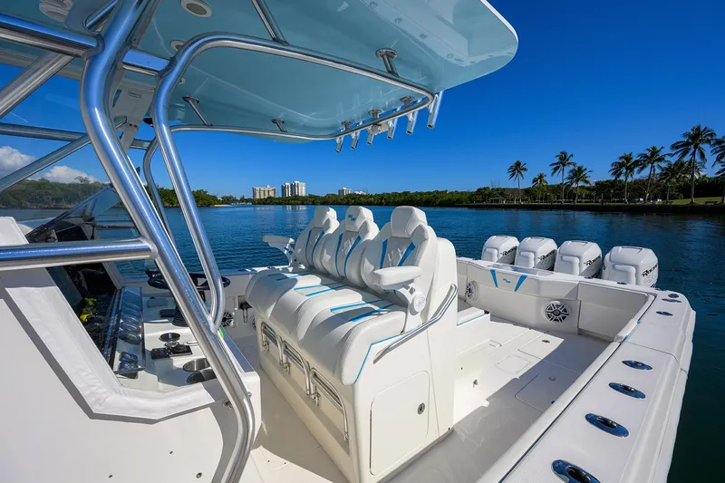 Slide: The Image of 2008 SeaVee 39b boat interior with white seating, blue accents, and scenic waterfront view. - 14