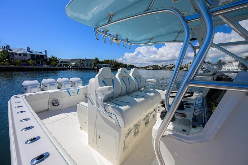 Slide: The Image of 2008 SeaVee 39b boat with luxurious seating and sleek design on a sunny waterfront. - 15