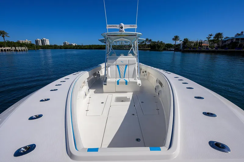 Slide: The Image of 2008 SeaVee 39b boat on calm water, showcasing spacious deck and sleek design. - 18