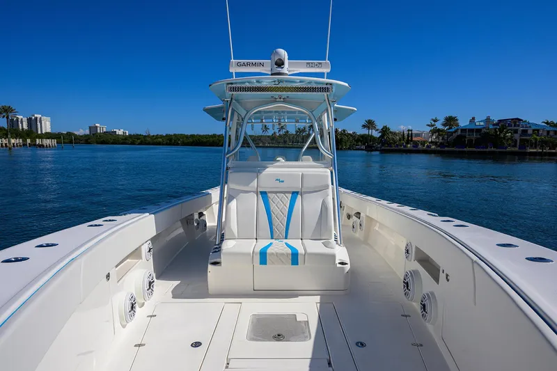 Slide: The Image of 2008 SeaVee 39b boat on calm water, featuring a spacious deck and modern helm. - 19