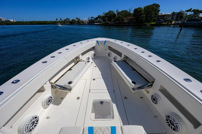 Slide: The Image of 2008 SeaVee 39b boat deck with seating, on calm water, under clear blue sky. - 21