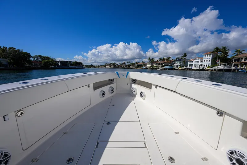 Slide: The Image of 2008 SeaVee 39b boat interior with open deck, clear skies, and waterfront view. - 22