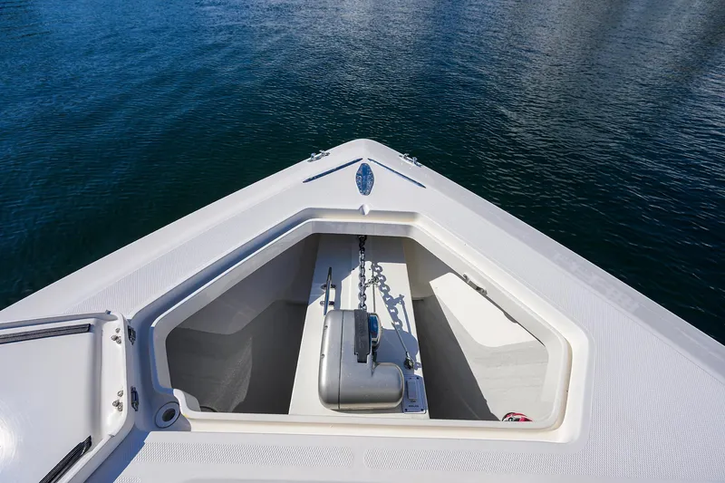 Slide: The Image of Bow of 2008 SeaVee 39b boat with anchor compartment, on calm water. - 24