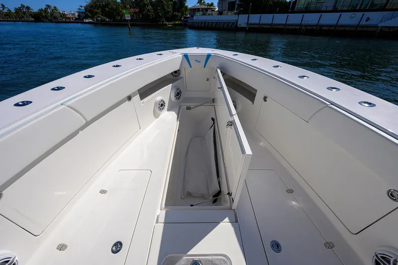 Slide: The Image of 2008 SeaVee 39b boat interior with open storage, sleek design, and waterfront view. - 25