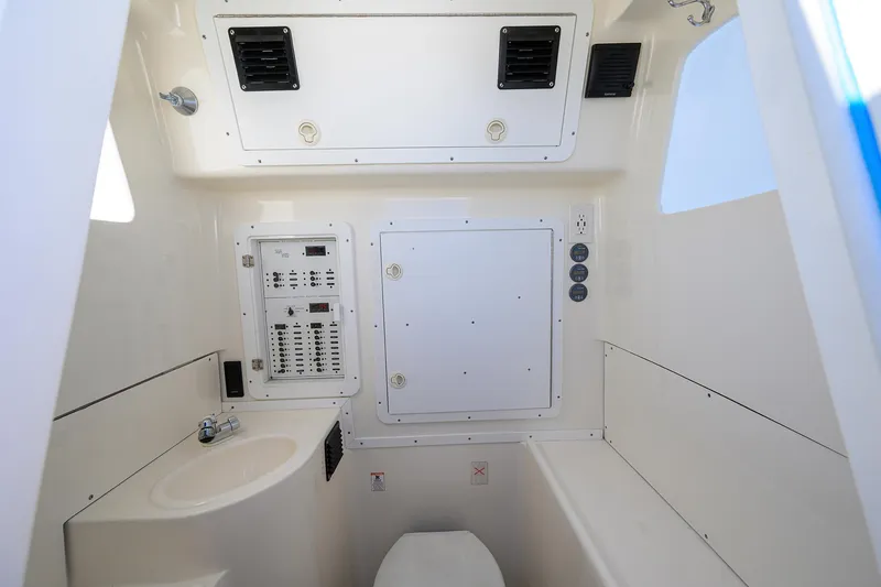 Slide: The Image of 2008 SeaVee 39b boat interior with control panel, sink, and toilet. - 27