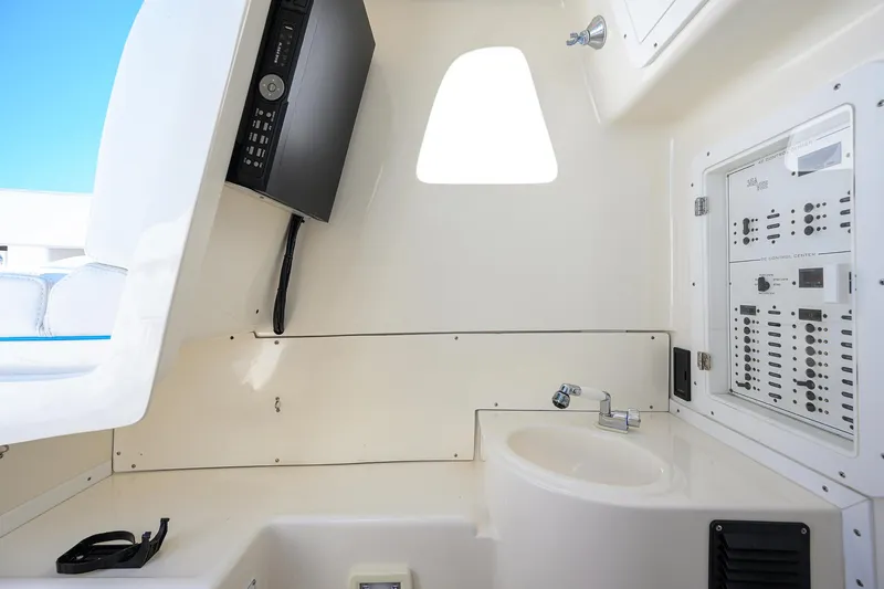 Slide: The Image of Interior of 2008 SeaVee 39b boat featuring control panel and sink. - 4
