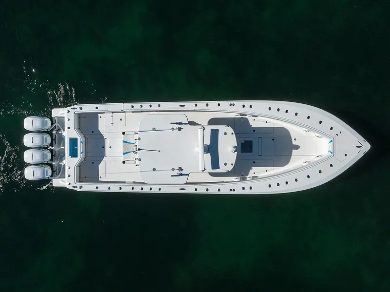 Slide: The Image of Aerial view of 2008 SeaVee 39b boat with triple outboard engines on calm water. - 6