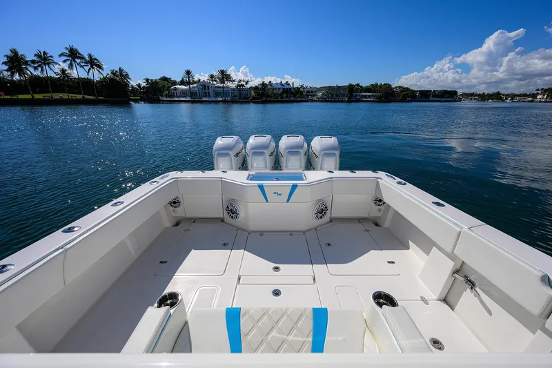 Slide: The Image of 2008 SeaVee 39b boat with spacious deck, four engines, and scenic waterfront view. - 7