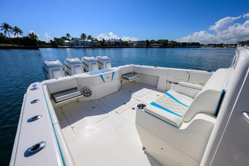 Slide: The Image of 2008 SeaVee 39b boat with spacious deck, four engines, and scenic waterfront view. - 9