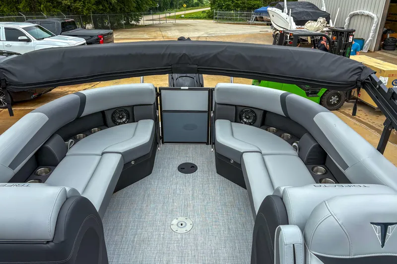 Slide: The Image of Luxurious 2025 Trifecta 24 RF CS pontoon boat interior with plush seating and modern design. - 5