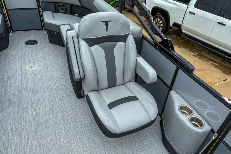 Slide: The Image of Luxurious seating on 2025 Trifecta 24 RF CS boat with cup holders and modern design. - 6