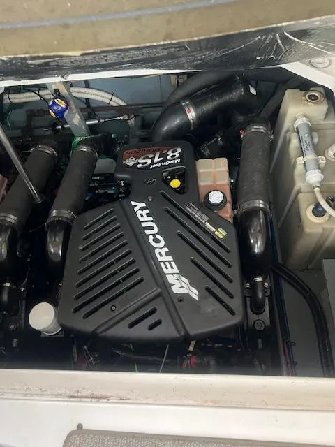 Slide: The Image of 2002 Sea Ray Sundancer engine compartment with Mercury 5.0L motor. - 28