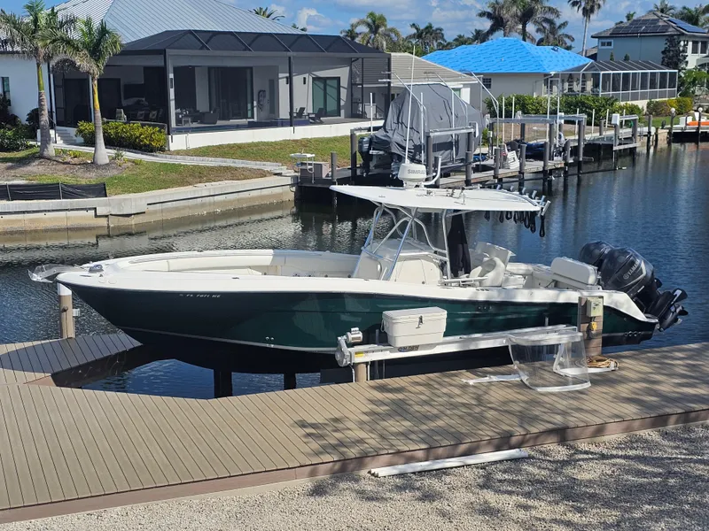 Slide: The Image of 2006 Hydra-Sports Vector 3300 CC boat docked in a scenic residential canal. - 1