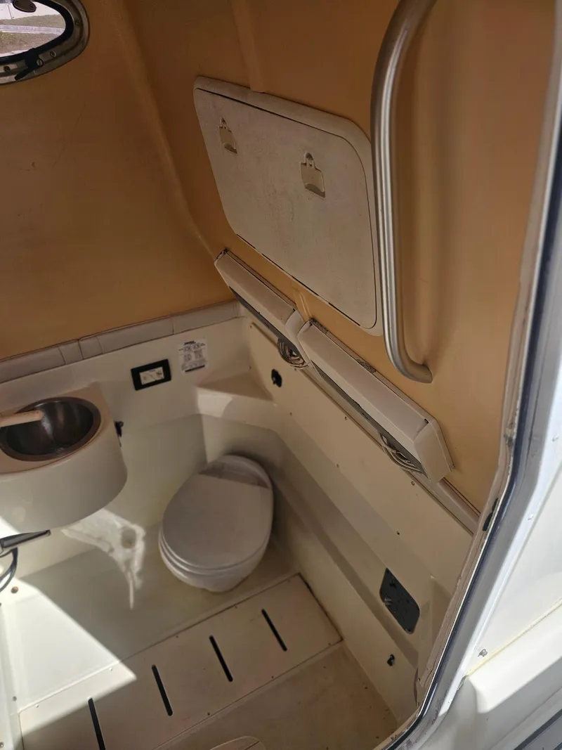 Slide: The Image of 2006 Hydra-Sports Vector 3300 CC boat interior with compact bathroom amenities. - 10