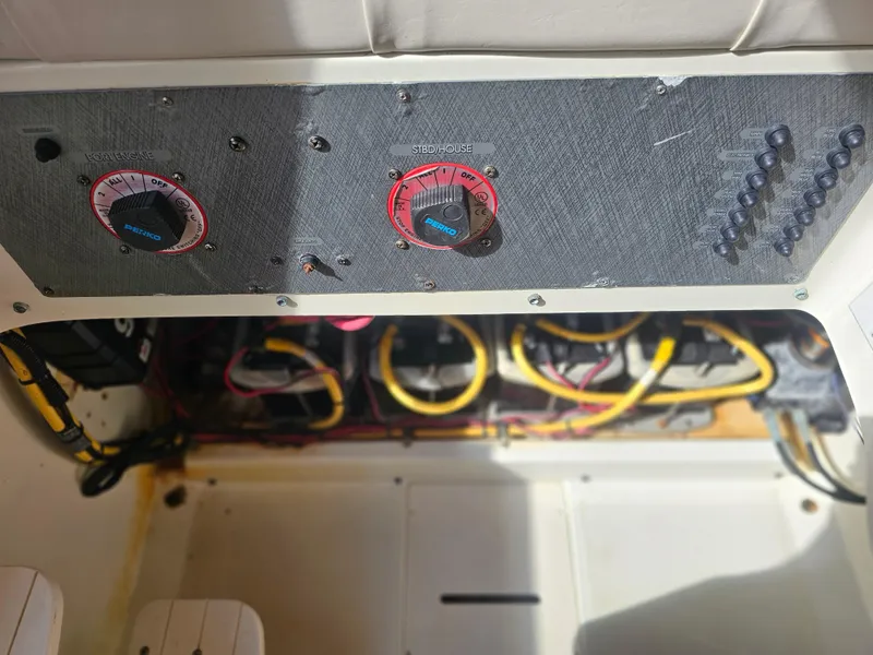 Slide: The Image of 2006 Hydra-Sports Vector 3300 CC control panel with wiring and switches. - 11