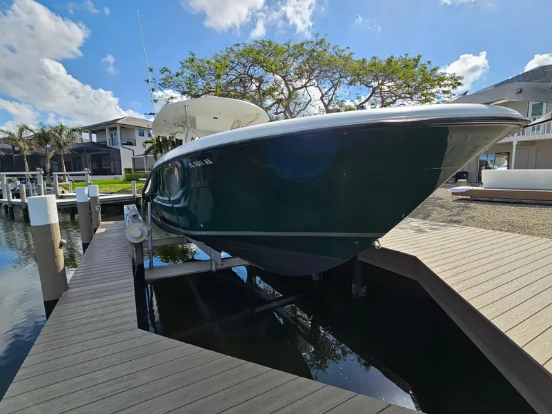 Slide: The Image of 2006 Hydra-Sports Vector 3300 CC boat docked, sunny day, waterfront homes in background. - 2