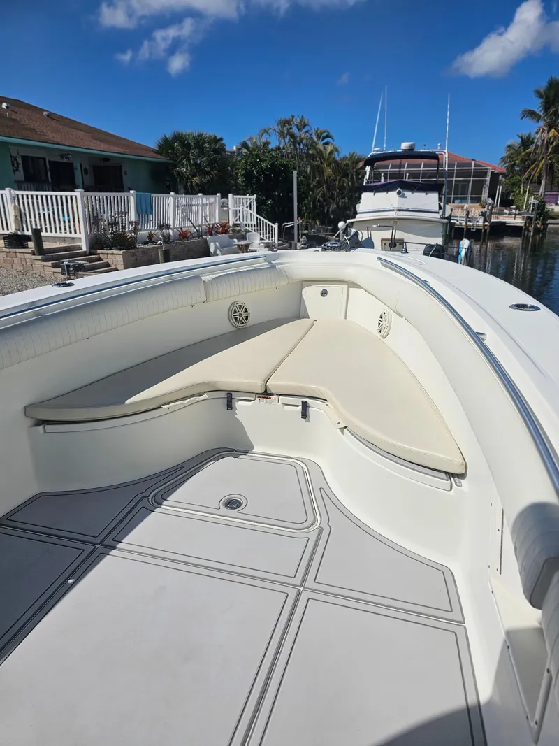 Slide: The Image of 2006 Hydra-Sports Vector 3300 CC boat with spacious seating, docked under a clear blue sky. - 7