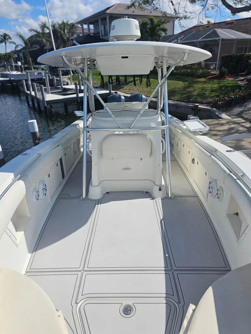Slide: The Image of 2006 Hydra-Sports Vector 3300 CC boat interior, docked by waterfront homes. - 8