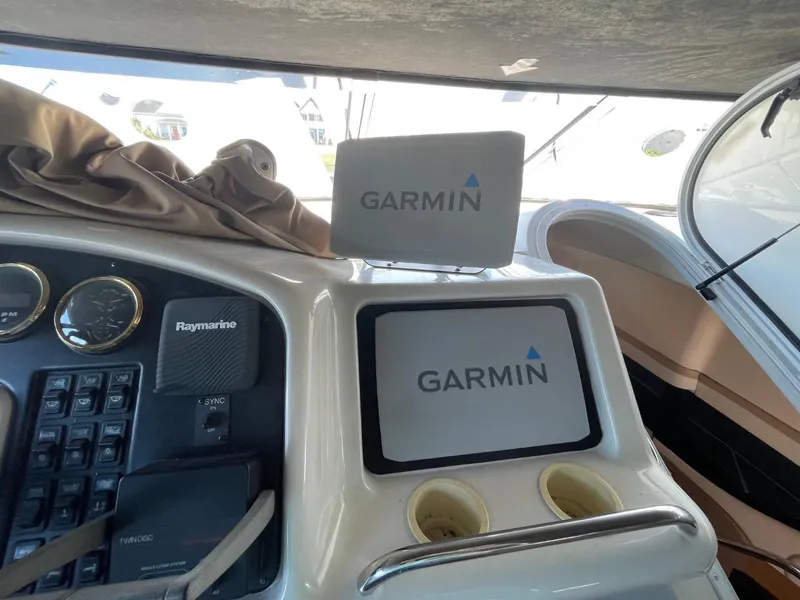 Slide: The Image of 1998 Carver 530 Voyager Pilothouse helm with Garmin navigation displays. - 17