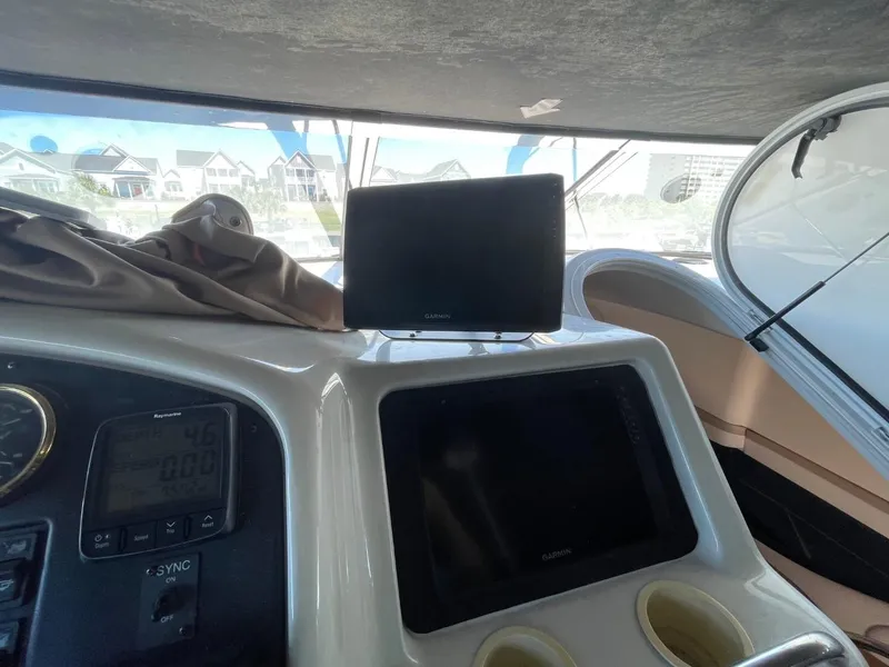 Slide: The Image of 1998 Carver 530 Voyager Pilothouse dashboard with navigation equipment and controls. - 19