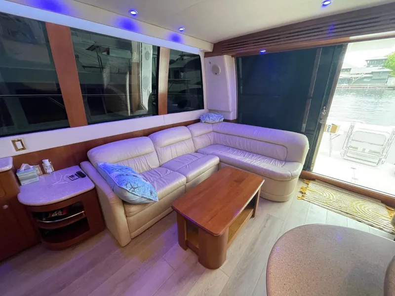 Slide: The Image of Luxurious interior of 1998 Carver 530 Voyager Pilothouse with leather seating and wooden accents. - 25