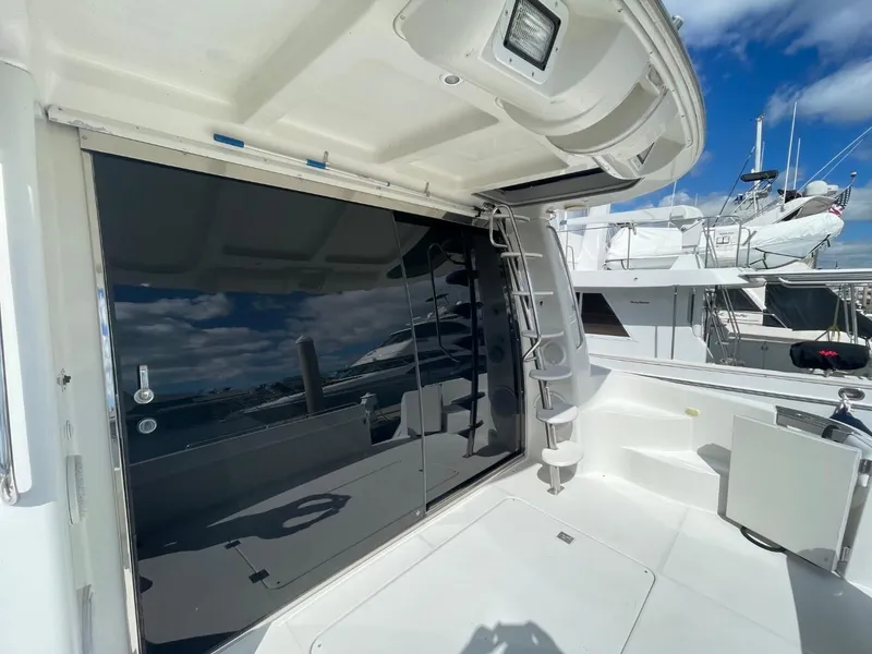 Slide: The Image of 1998 Carver 530 Voyager Pilothouse yacht deck with sleek design and modern features. - 9
