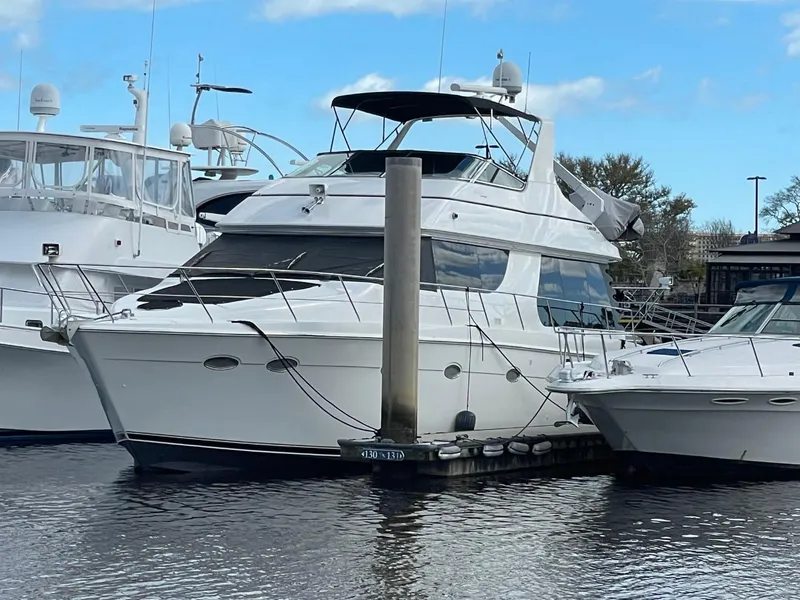 Slide: The Image of 1998 Carver 530 Voyager Pilothouse yacht docked at marina. - 14