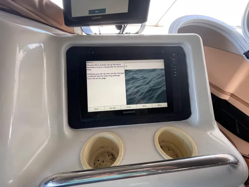 Slide: The Image of 1998 Carver 530 Voyager Pilothouse dashboard with Garmin navigation display. - 18