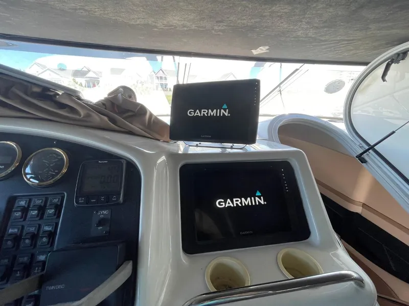 Slide: The Image of 1998 Carver 530 Voyager Pilothouse dashboard with Garmin navigation displays. - 20