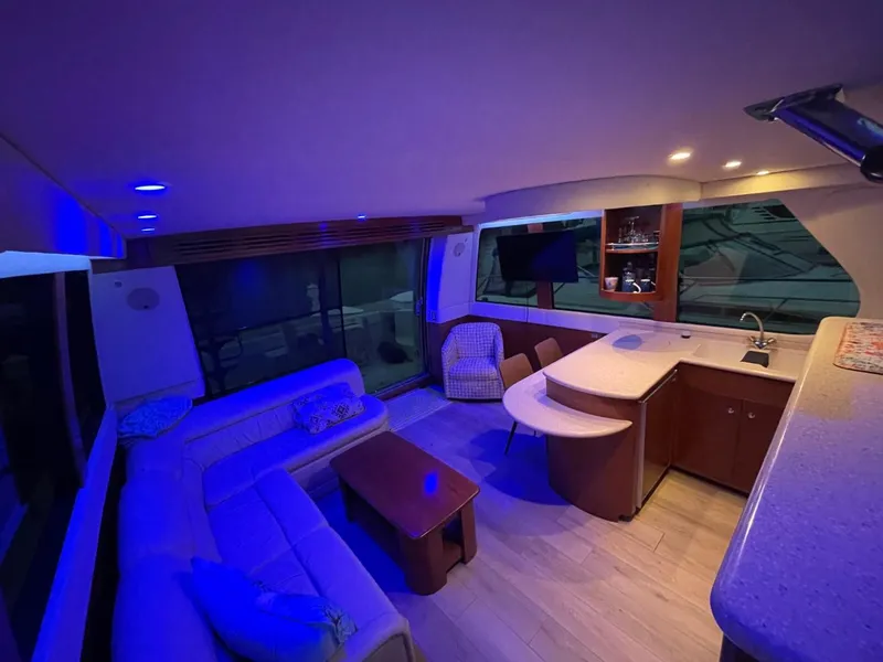 Slide: The Image of Luxurious interior of 1998 Carver 530 Voyager Pilothouse with modern seating and ambient lighting. - 26