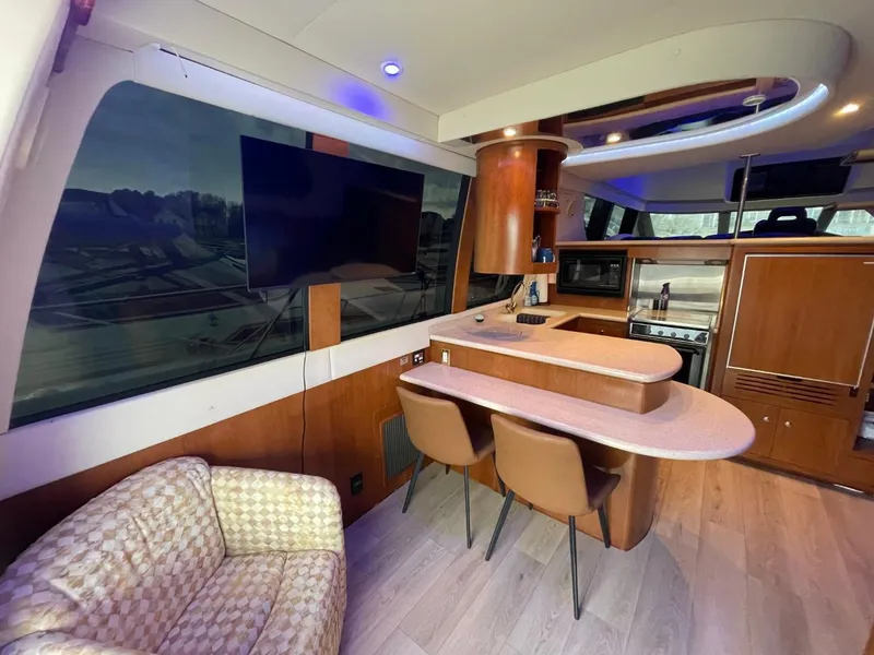 Slide: The Image of Interior of 1998 Carver 530 Voyager Pilothouse with modern kitchen and seating area. - 37