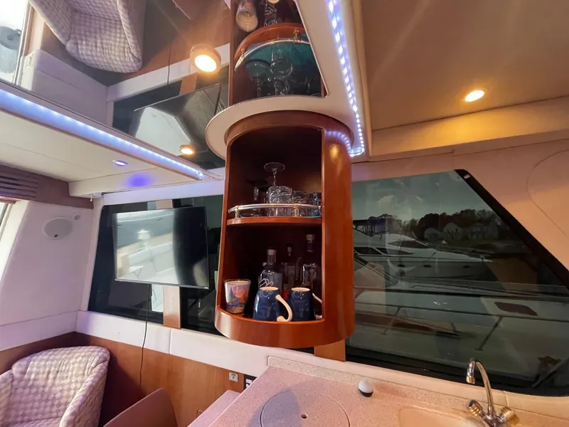 Slide: The Image of Interior of 1998 Carver 530 Voyager Pilothouse with bar and modern lighting. - 40