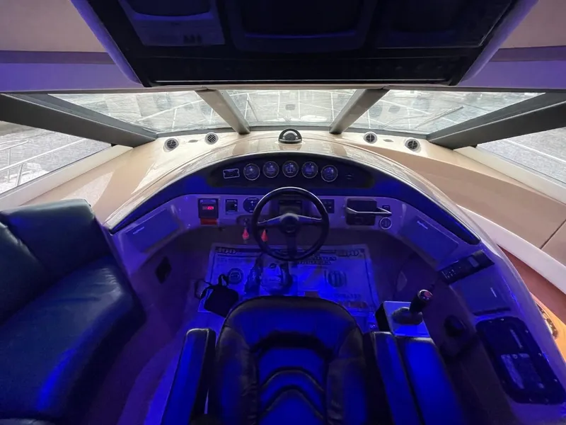 Slide: The Image of Interior of 1998 Carver 530 Voyager Pilothouse cockpit with steering wheel and control panel. - 45